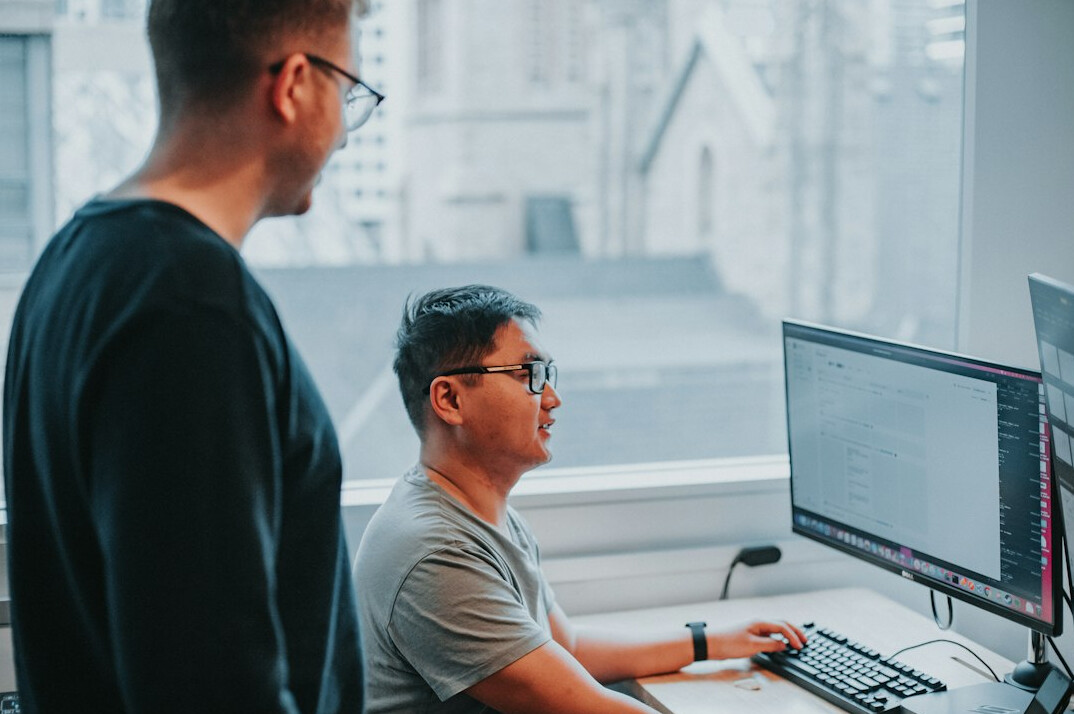 software developers coding together